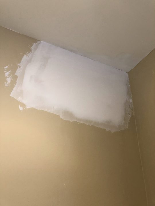 After: Hole in a ceiling patched and blended into the paint