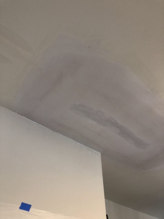 After: Ceiling cut open to fix a leak, then patched and finished