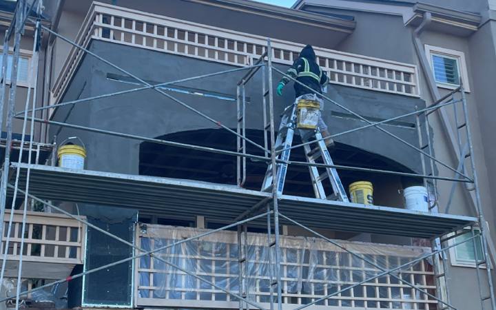 EIFS on scaffold, Patriot Drywall & Plastering project