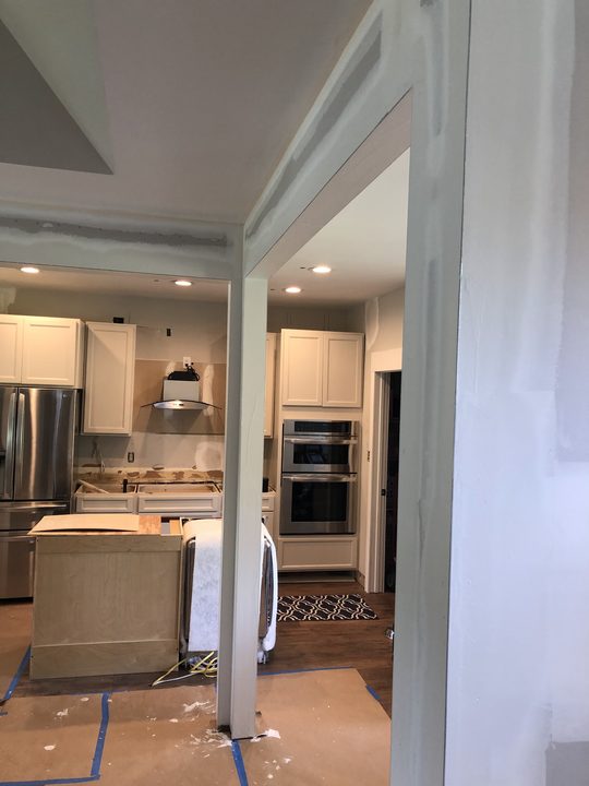 After: Kitchen opening framed and wrapped, then finished