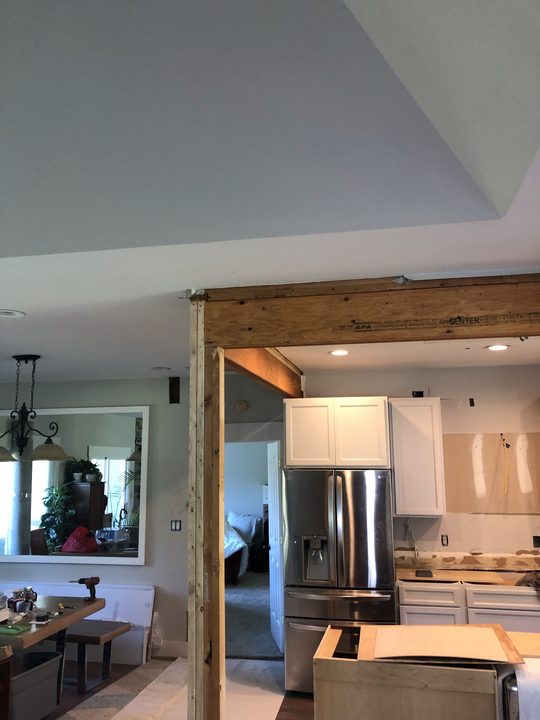 Before: Kitchen opening framed and wrapped, then finished